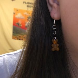 Orange gummy bear earrings.